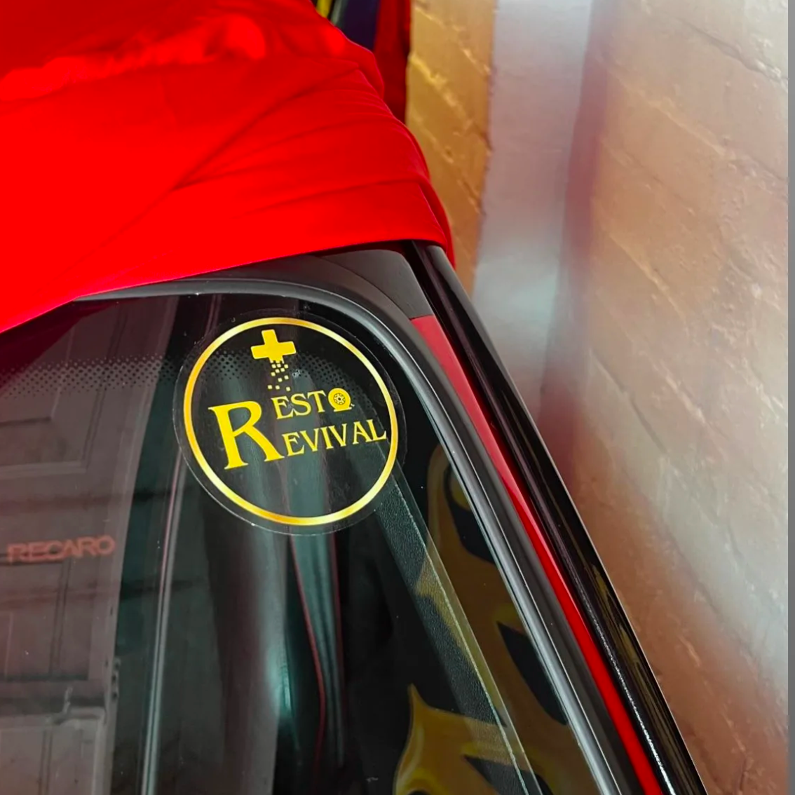 Resto Revival Transparent window sticker on car windshield